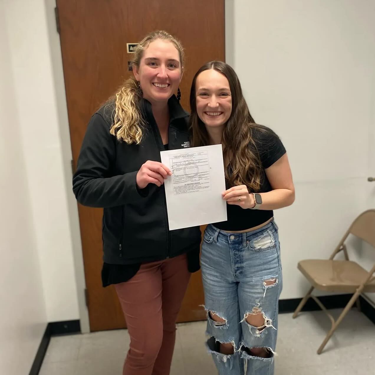 two girls with a flying certificate